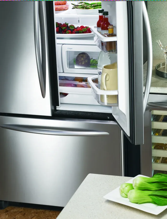 French-door refrigerator open with fresh food inside