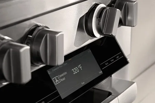 Range knobs and a display set to convection roast at 320°F