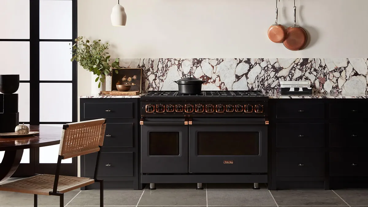 Black Viking dual-fuel range with copper trim